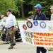 Veterans, including Anthony Derezinski (high five-ing a spectator in the background), and active duty military led the Glacier Area Homeowners Association Memorial Day Parade on Monday, May 27. Ben Freed I AnnArbor.com